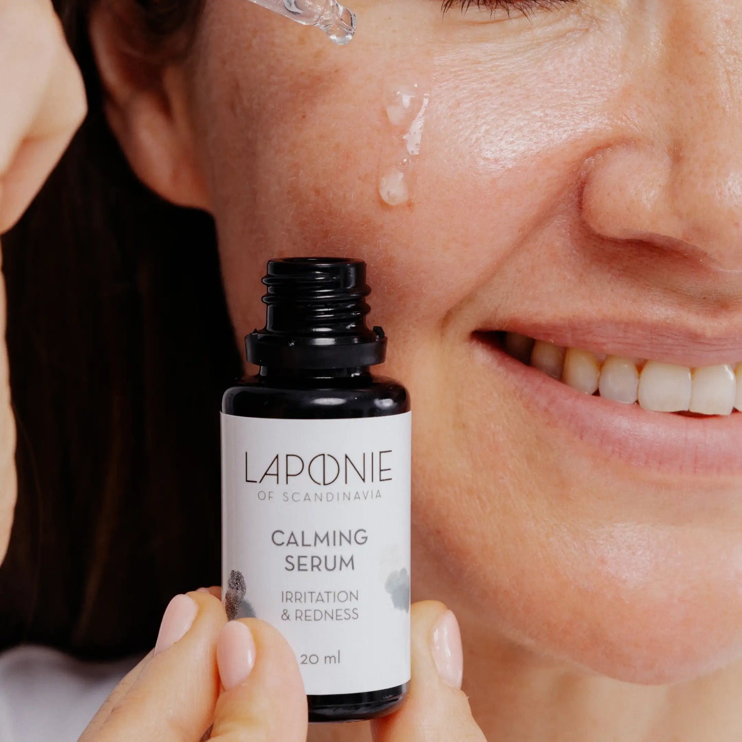 Laponie Calming Serum applied to cheek with pipette