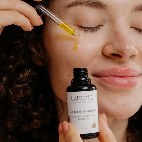 Laponie Softening Face Oil applied with pipette onto cheek
